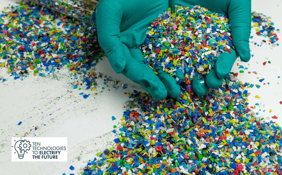 Small pieces of colourful plastic in hands and on the table